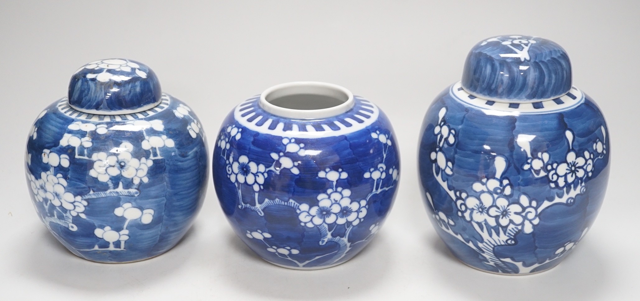 Three Chinese blue and white prunus jars, late 19th / early 20th century, tallest 16cm